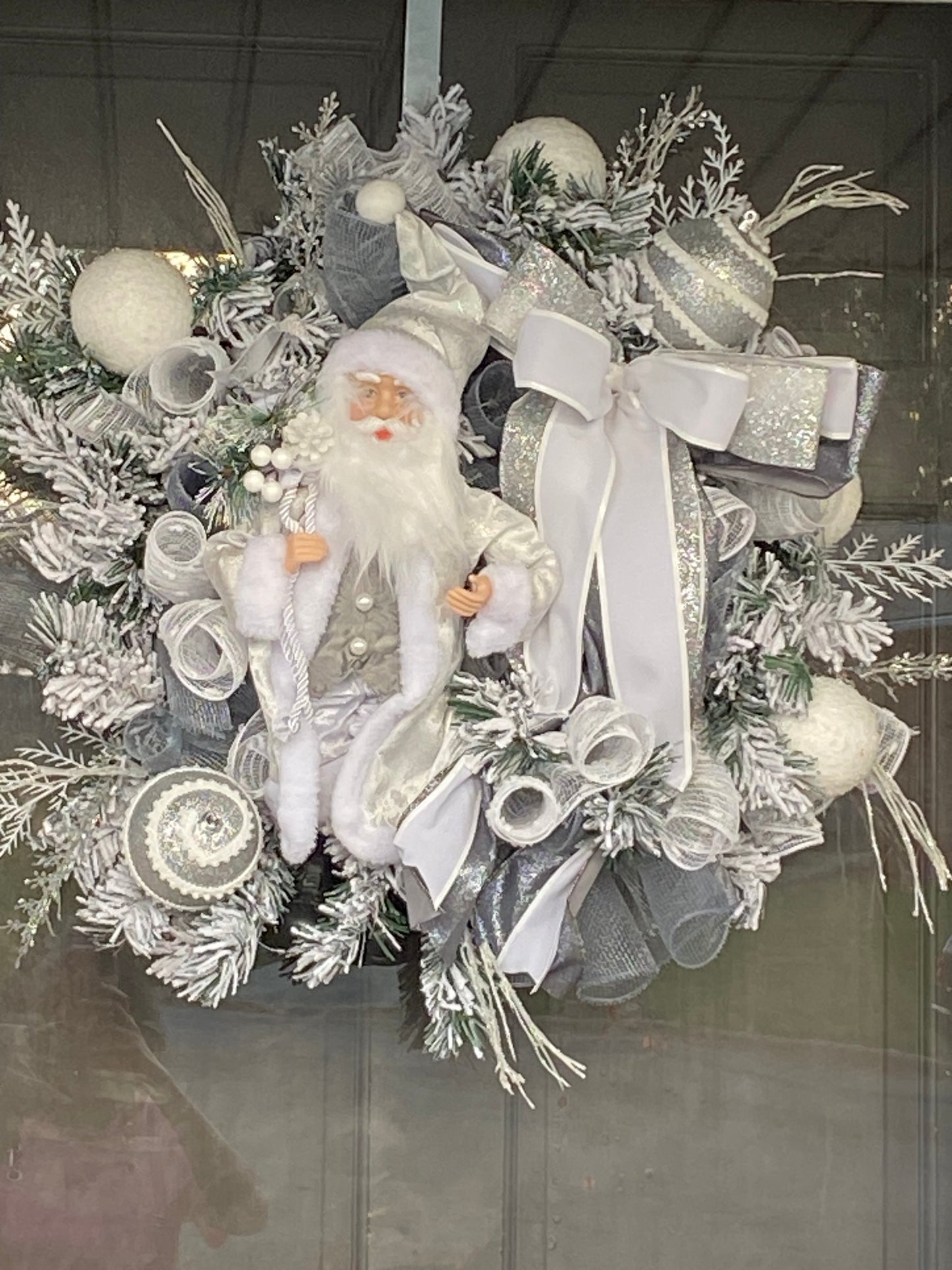 White Santa Wreath on 24 inch flocked evergreen base. Shipping included
